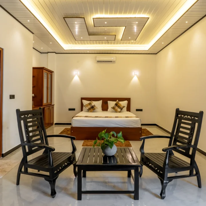 Spacious King Room at Arice Unawatuna featuring sitting chairs, soft lighting, and elegant interior.