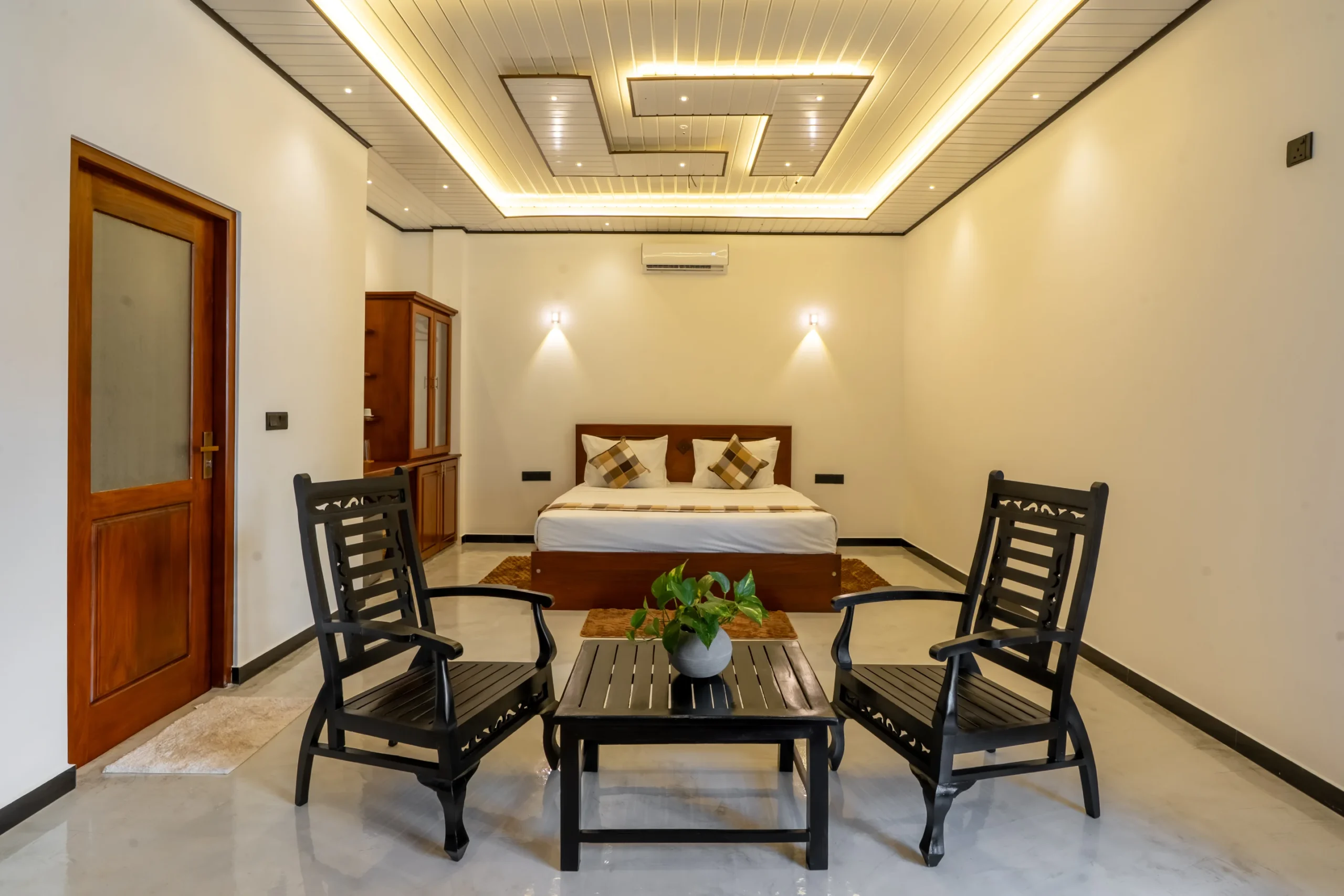 Spacious King Room at Arice Unawatuna featuring sitting chairs, soft lighting, and elegant interior.