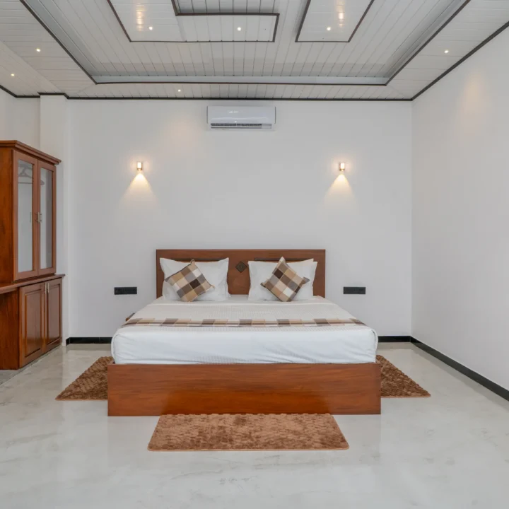 King Room at Arice Unawatuna with minimalist décor, wooden furniture, and warm lighting