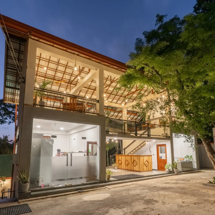 Night-time view of pool and lounge chairs at Arice Eco Villa Unawatuna