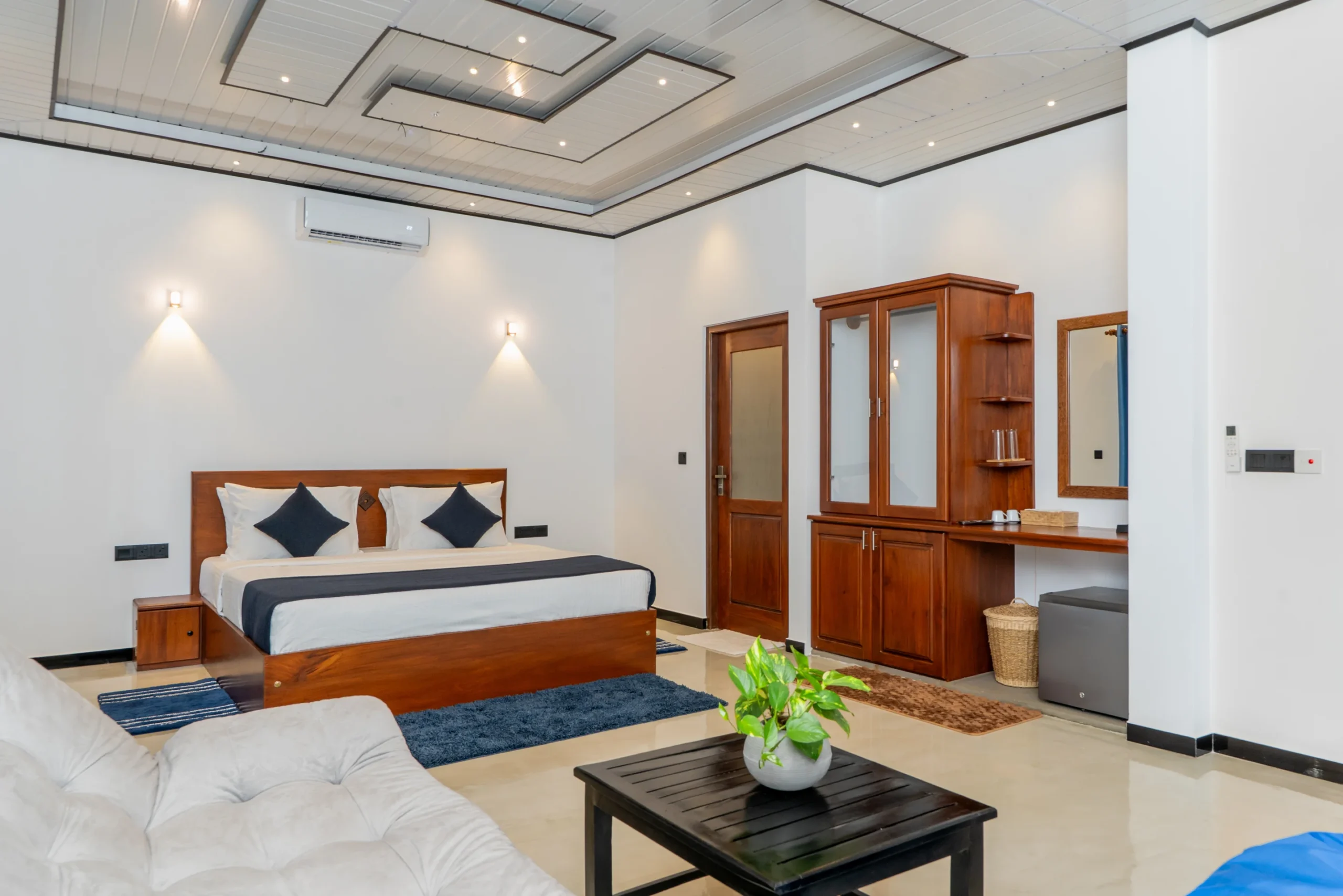 Bright king bedroom with wooden furniture and stylish ceiling design