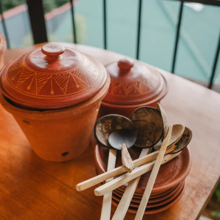 Close-up of Sri Lankan clay cooking pots and ladles at Arice Eco Villa restaurant